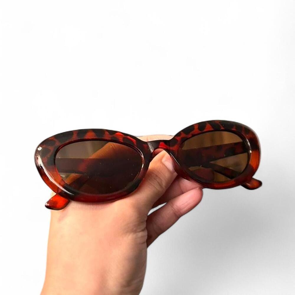 Brown and black vintage oval eye sunglasses vibes